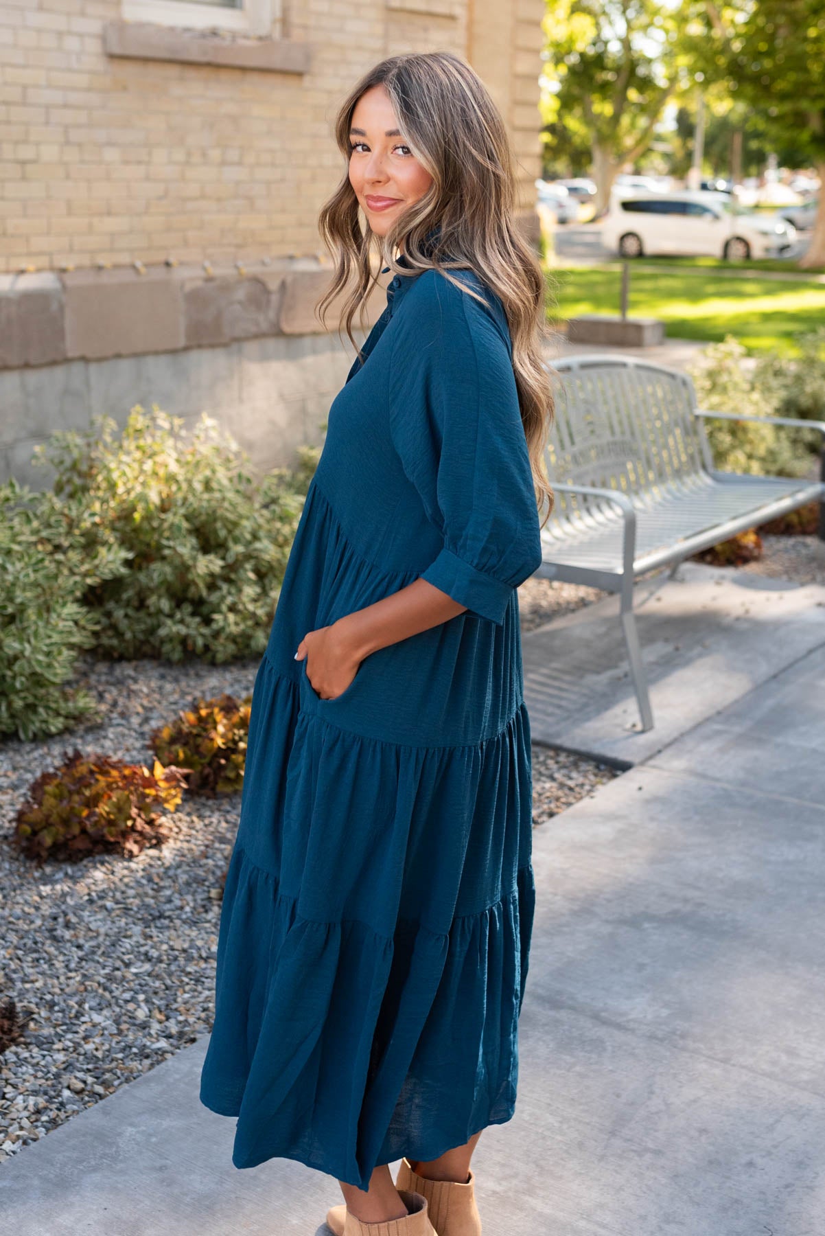 Side view of the deep teal tiered dress