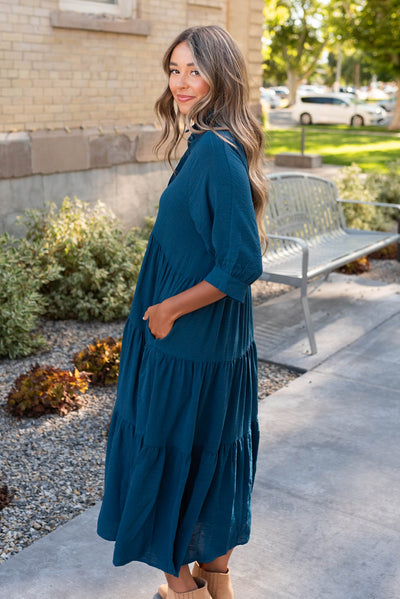 Side view of the deep teal tiered dress