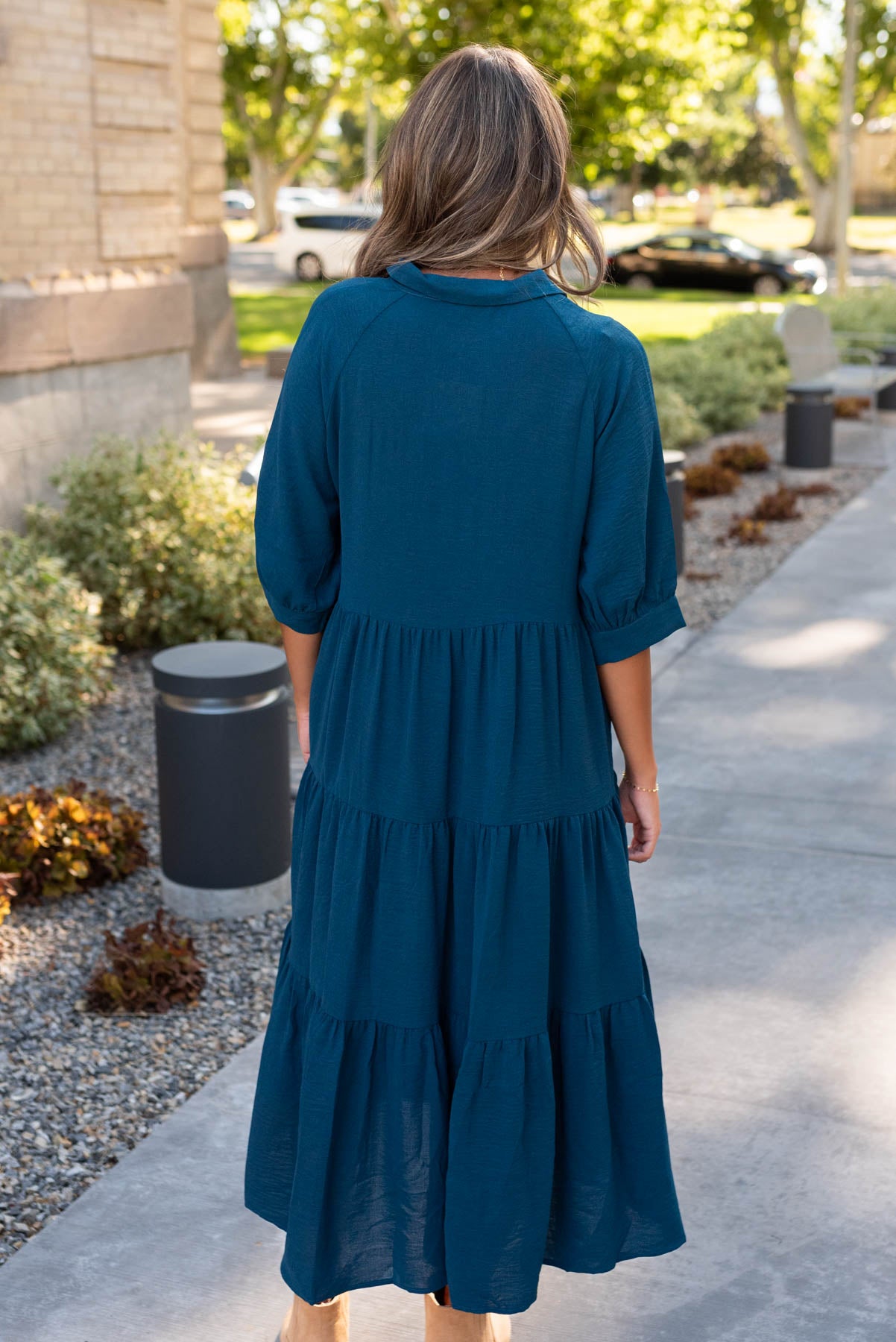 Back view of the deep teal tiered dress