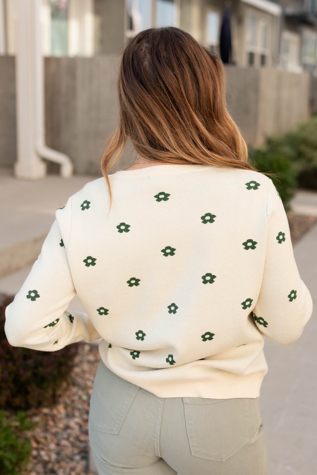 Back view of the cream green floral sweater