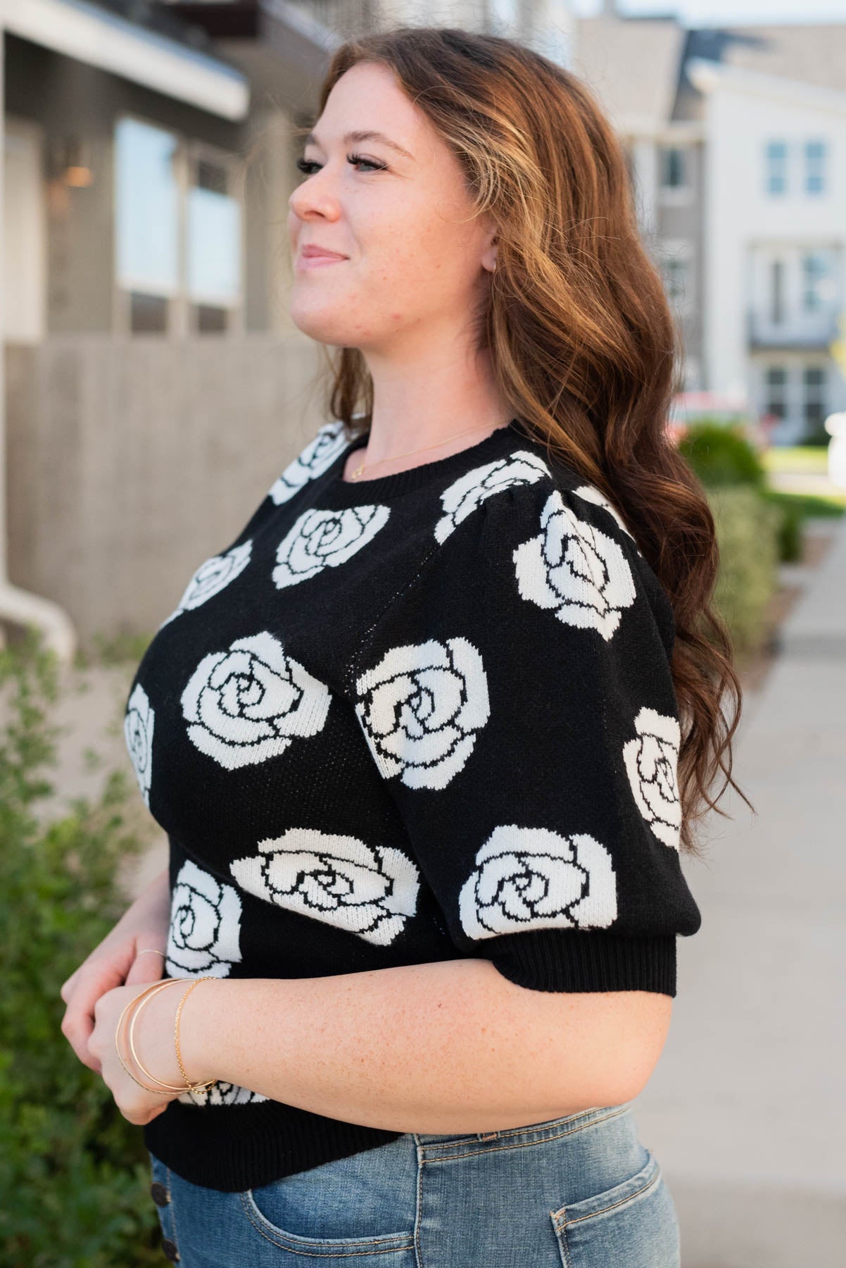 Side view of the plus size black floral print sweater