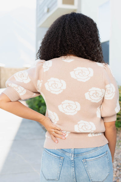 Back view of the taupe floral print sweater