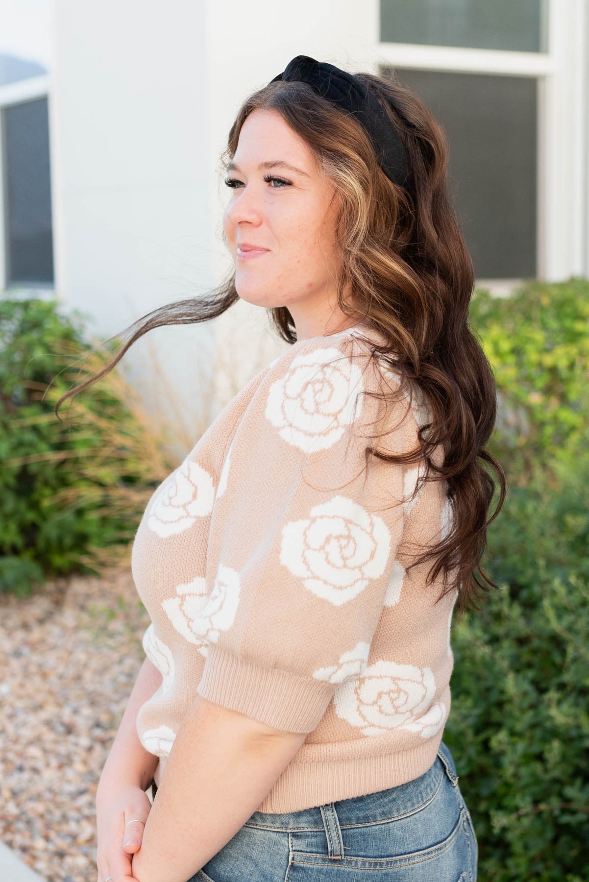 Side view of the taupe floral printed sweatr in plus size