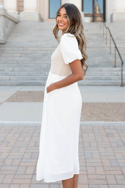 Side view of the ivory knit bodice dress