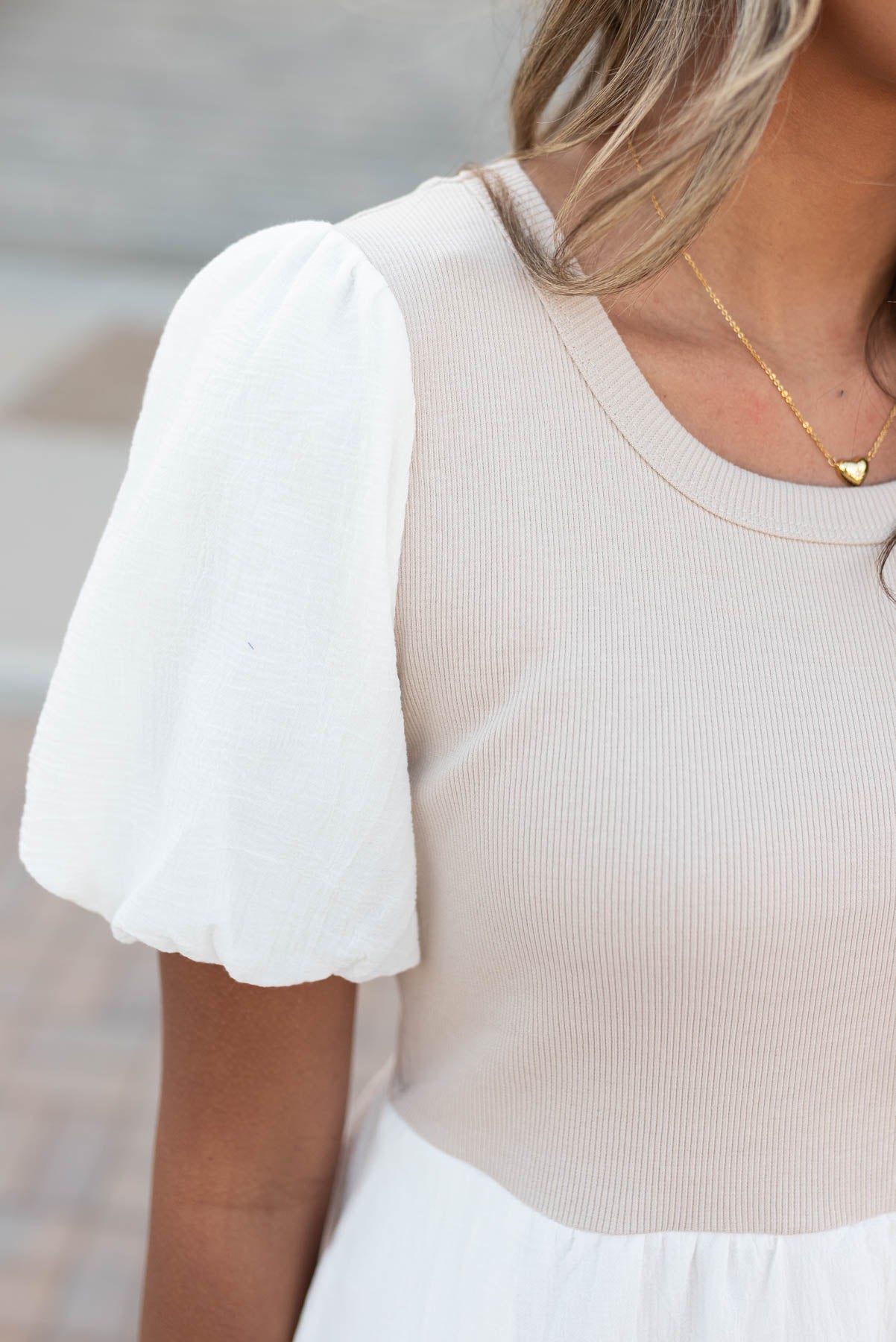 Close up of the sleeves on the ivory knit bodice dress