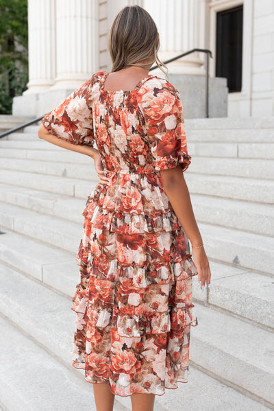 Back view of the rust floral ruffle dress