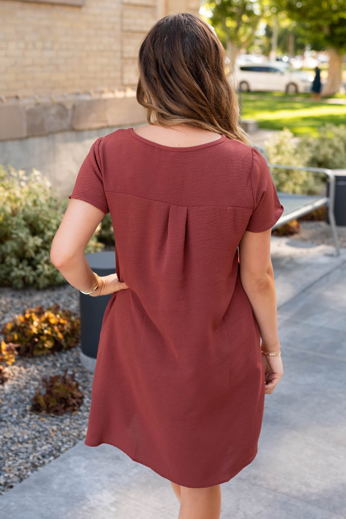 Back view of the brick red relaxed dress