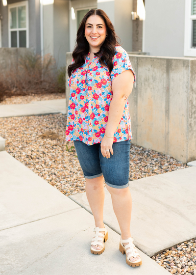 Front view of the plus size blush multi floral top