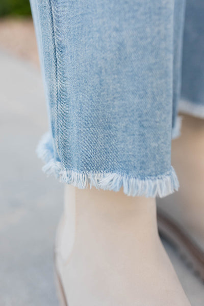 Distressed hem on the light wide leg jeans