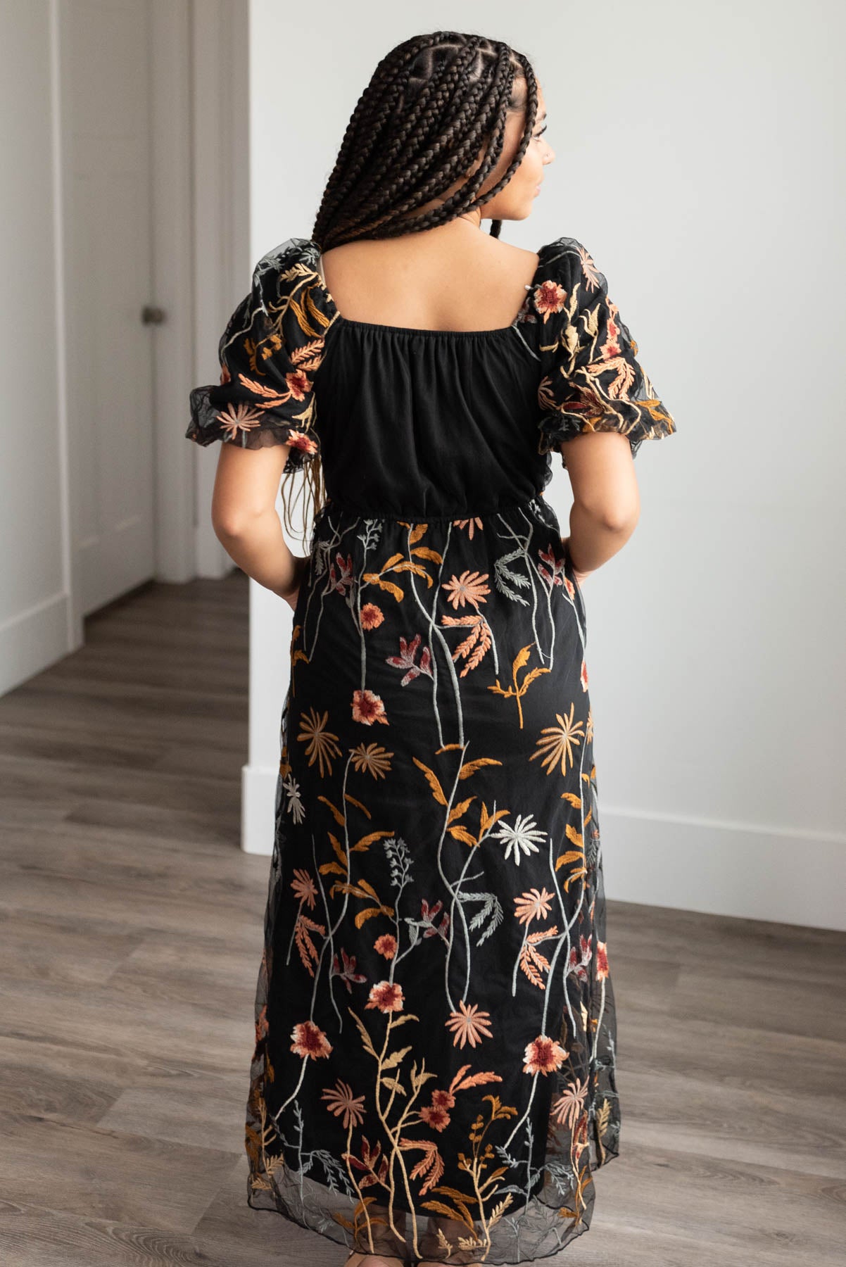 Back view of the black embroidered dress