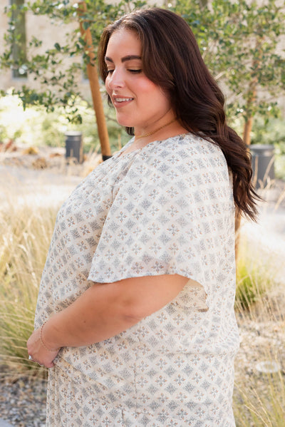 Side view of the plus size cream pattern chiffon top