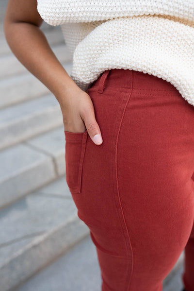 Close up of the back pocket on the red clay high rise pants