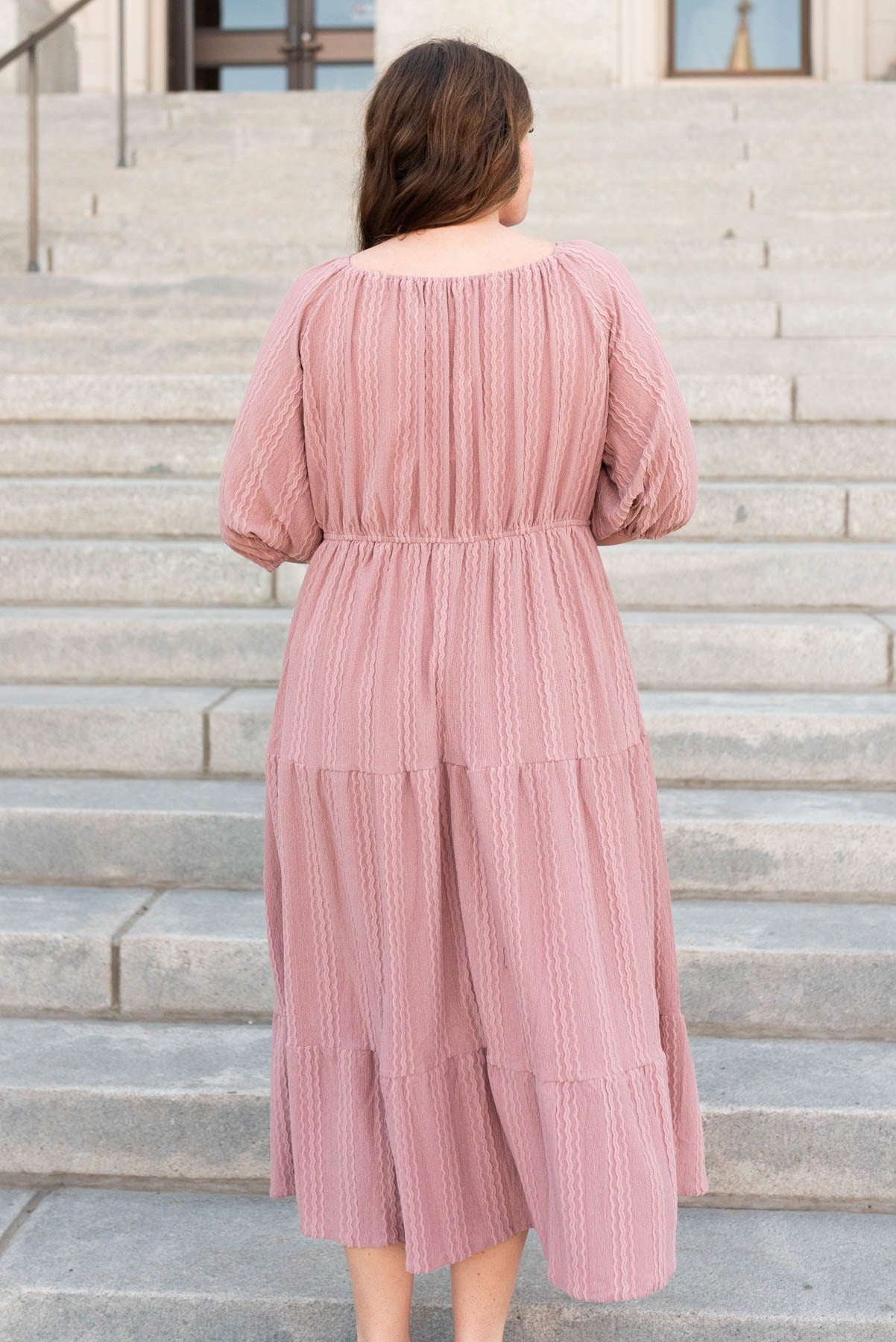 Back view of the plus size dusty mavue textured dress