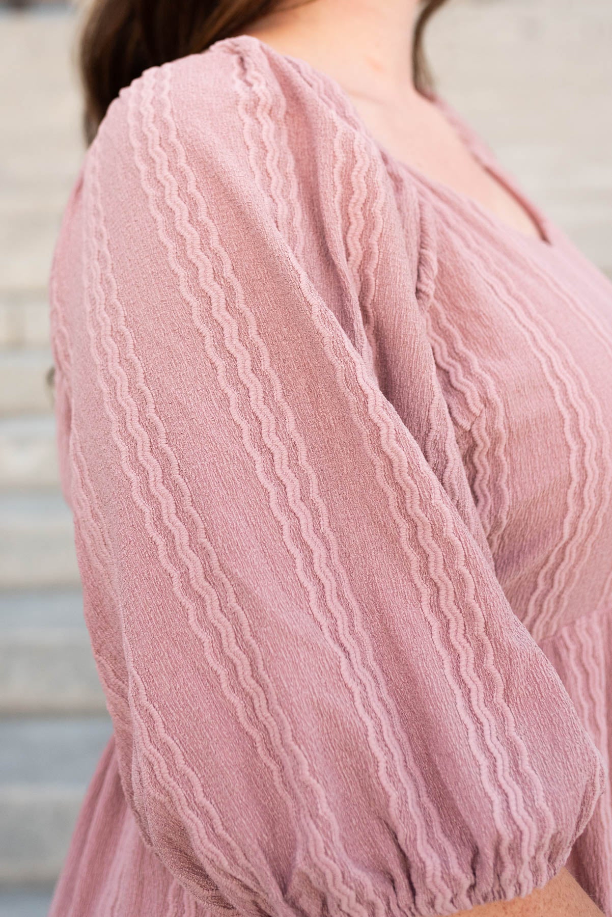 Close up of the textured fabric on the plus size  mavue textured  dress