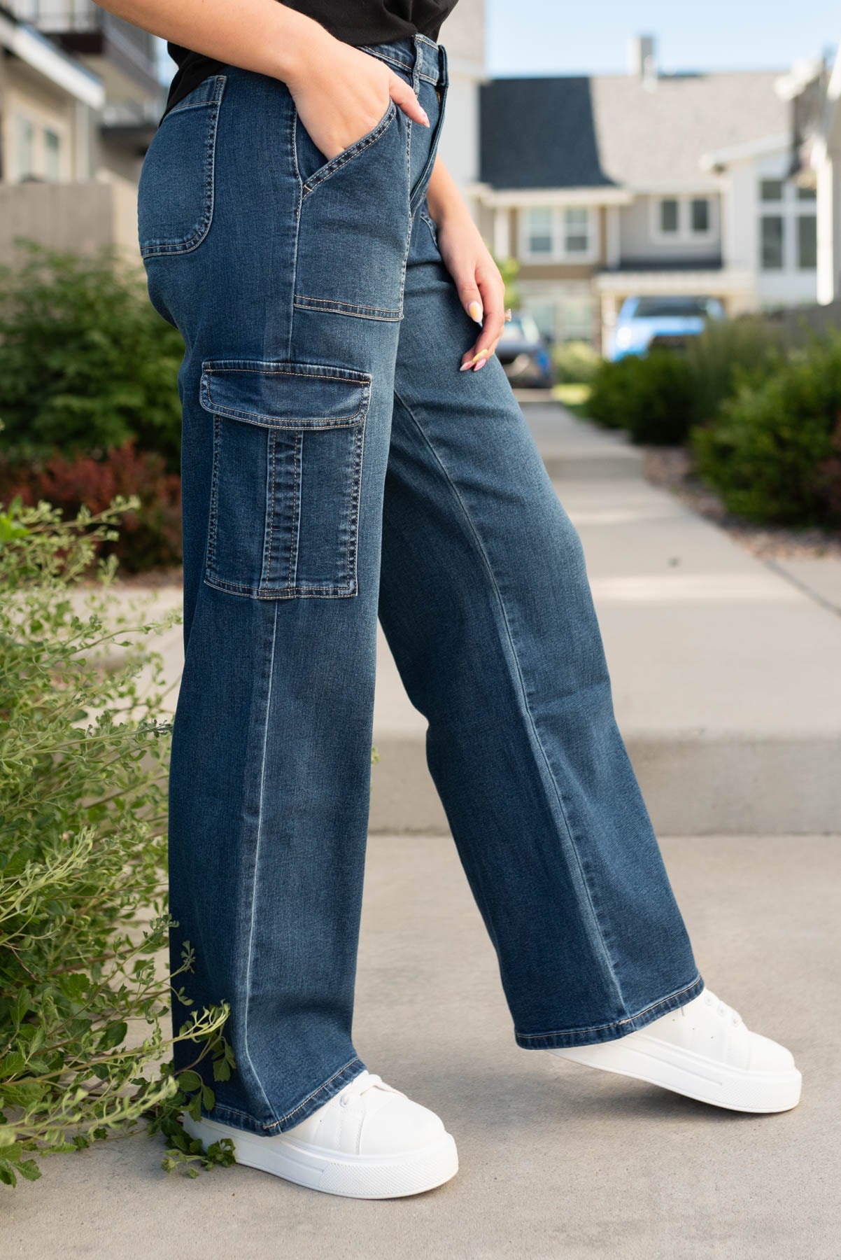 Side view of the dark wash cargo jeans