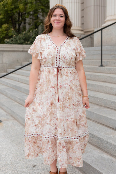 Front view of the burgundy floral lace dress with ribbon trim