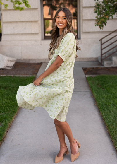 Side view of the green tierd dress with short sleeves