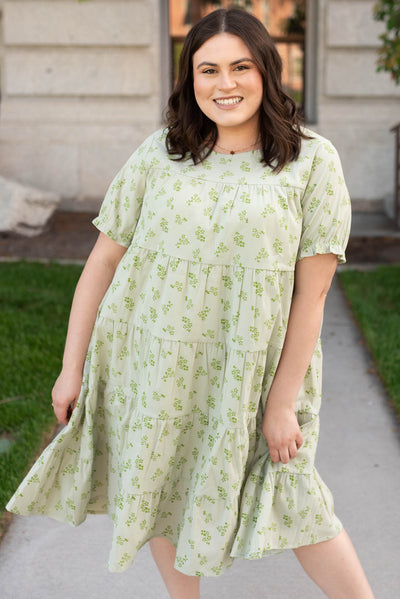 Just below the knee plus size green tiered dress with short sleeves