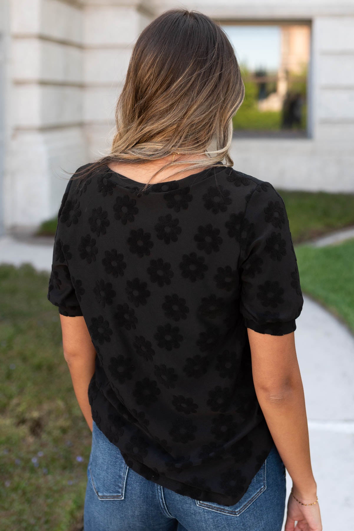 Back view of the black floral pattern top