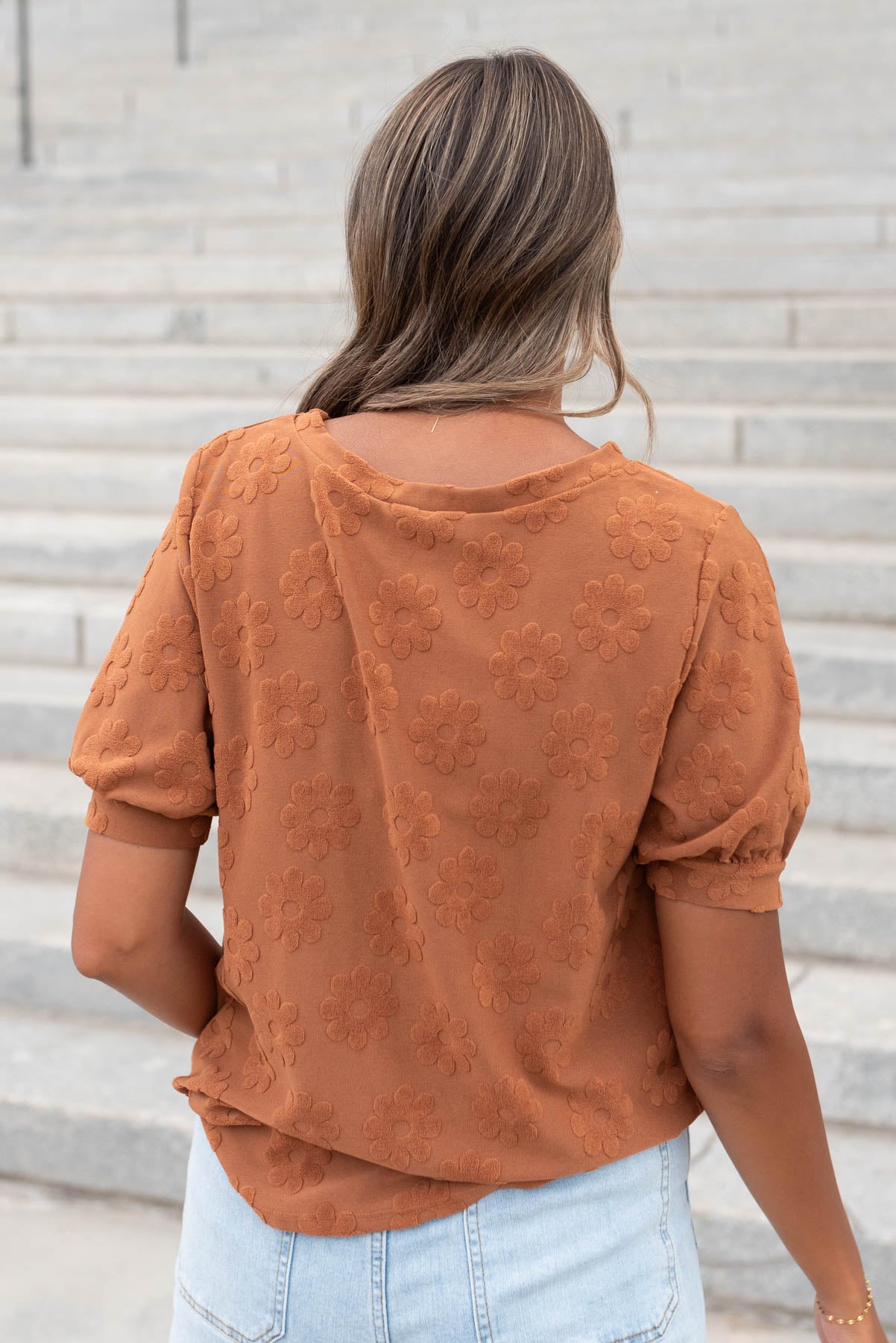 Back view of the cinnamon floral pattern top