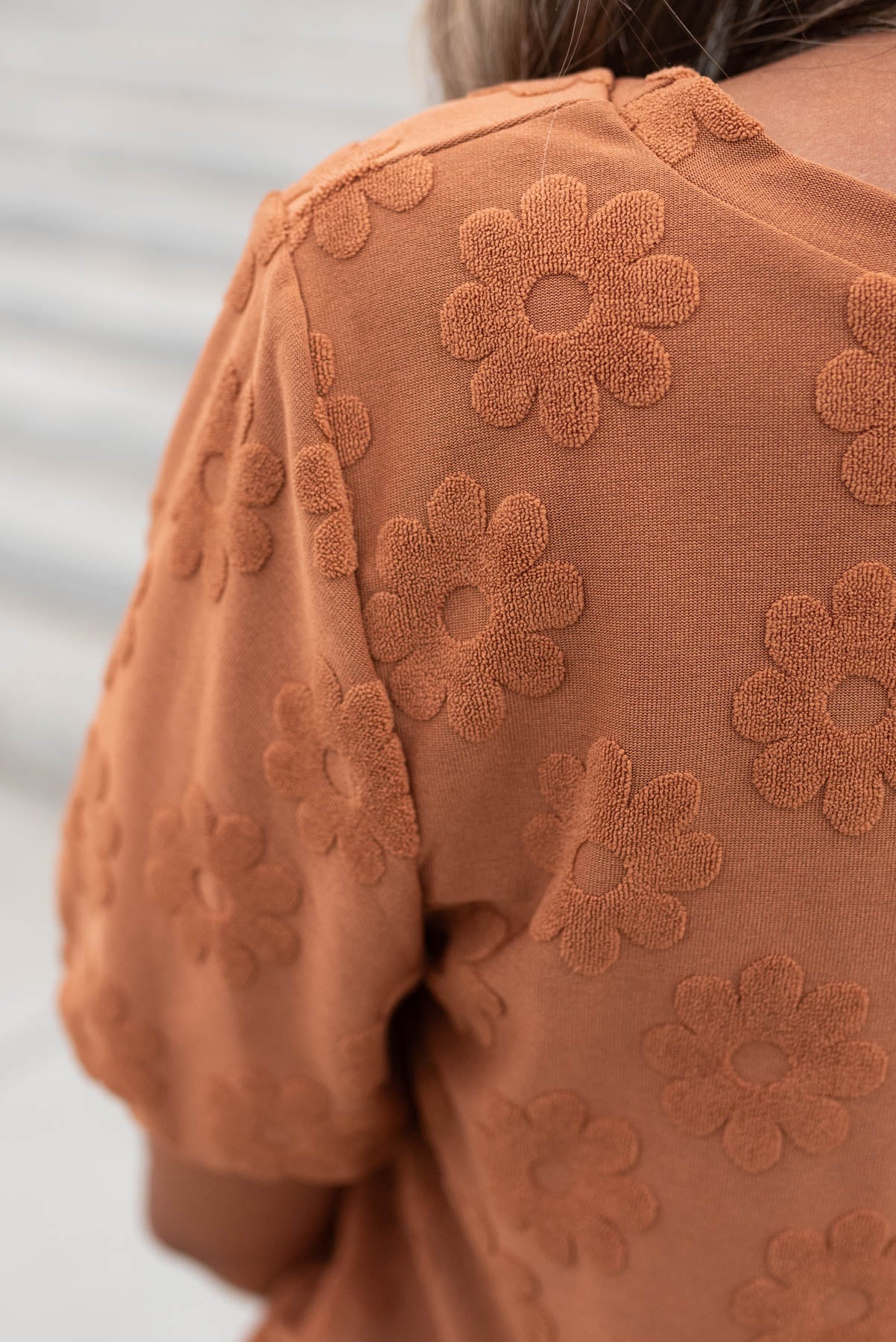 Close up of the fabric on the cinnamon floral pattern top