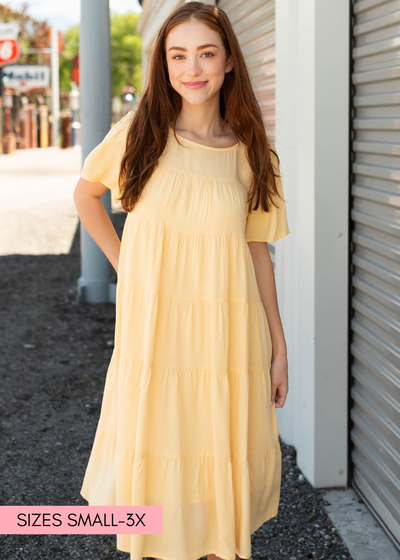 Light yellow tiered dress with short sleeves