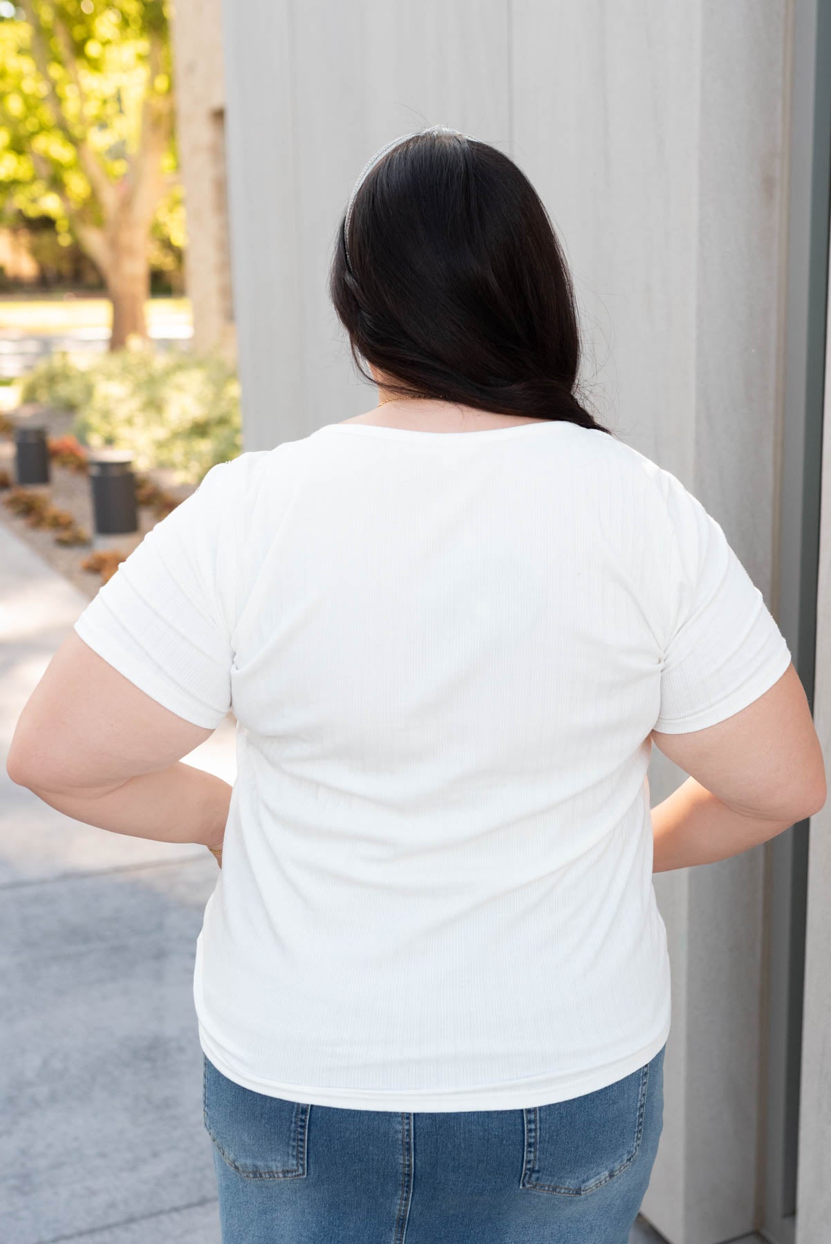 Back view of the plus size ivory ribbed top