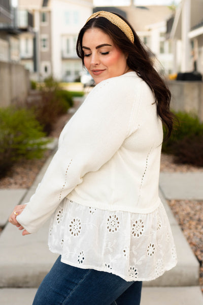 Side view of the off white cardigan