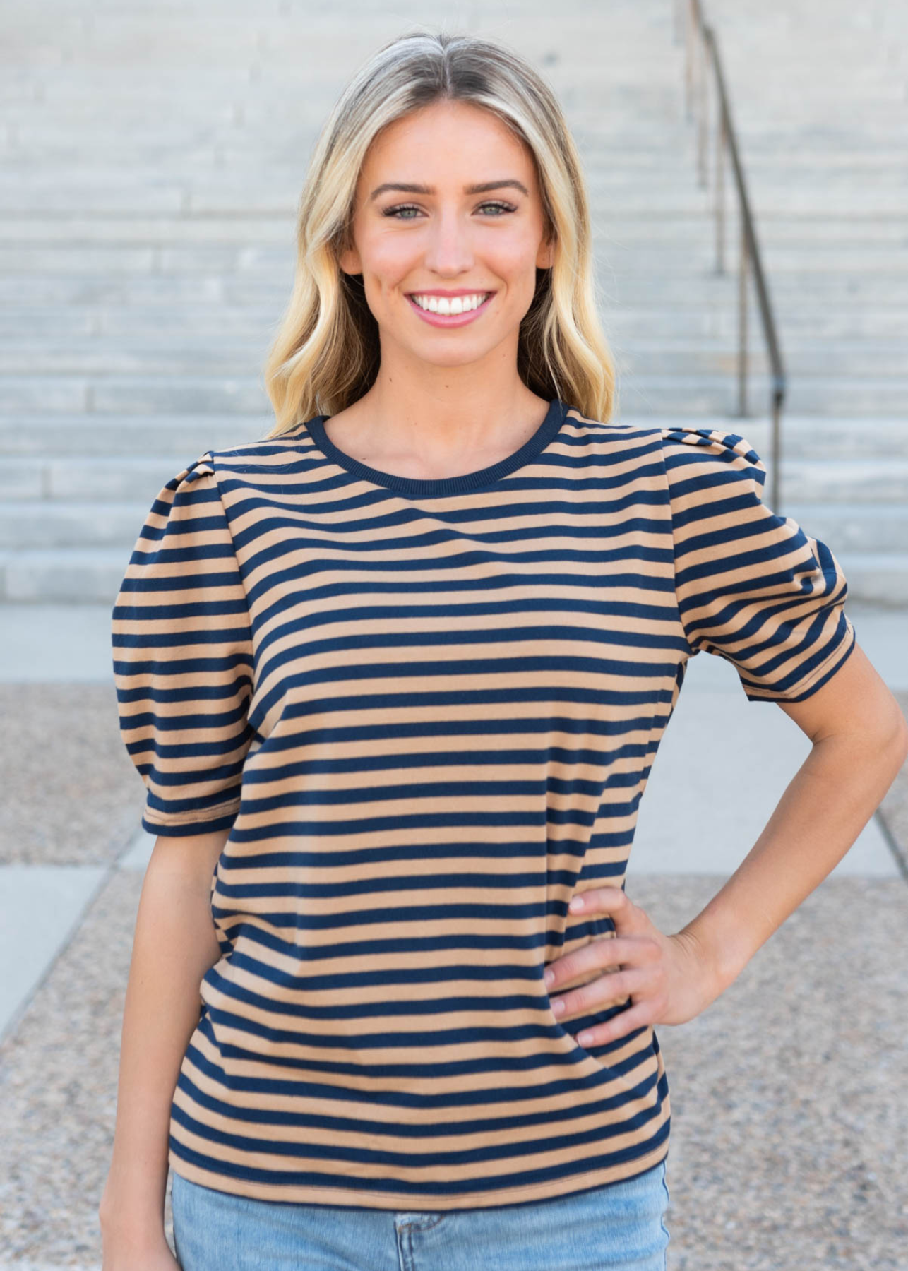 Navy camel stirpe top with navy trim around the neck