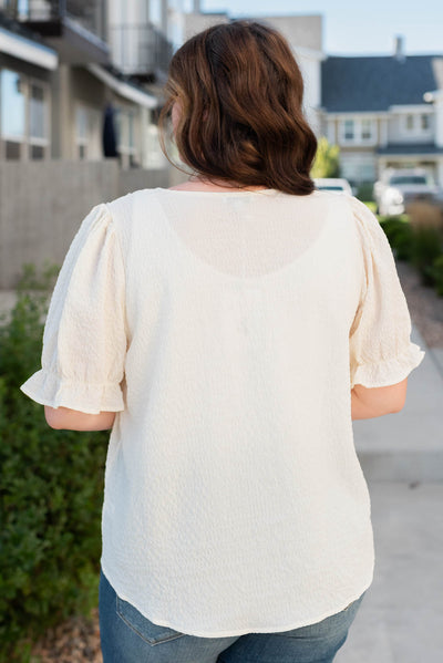 Back view of the plus size ivory blouse