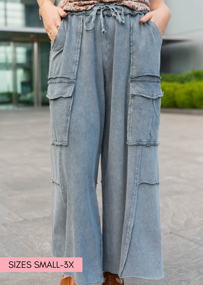 Faded blue wide leg pants with pockets and elastic waist