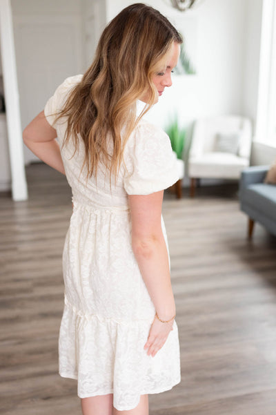 Side view of the off white ruffle lace dress