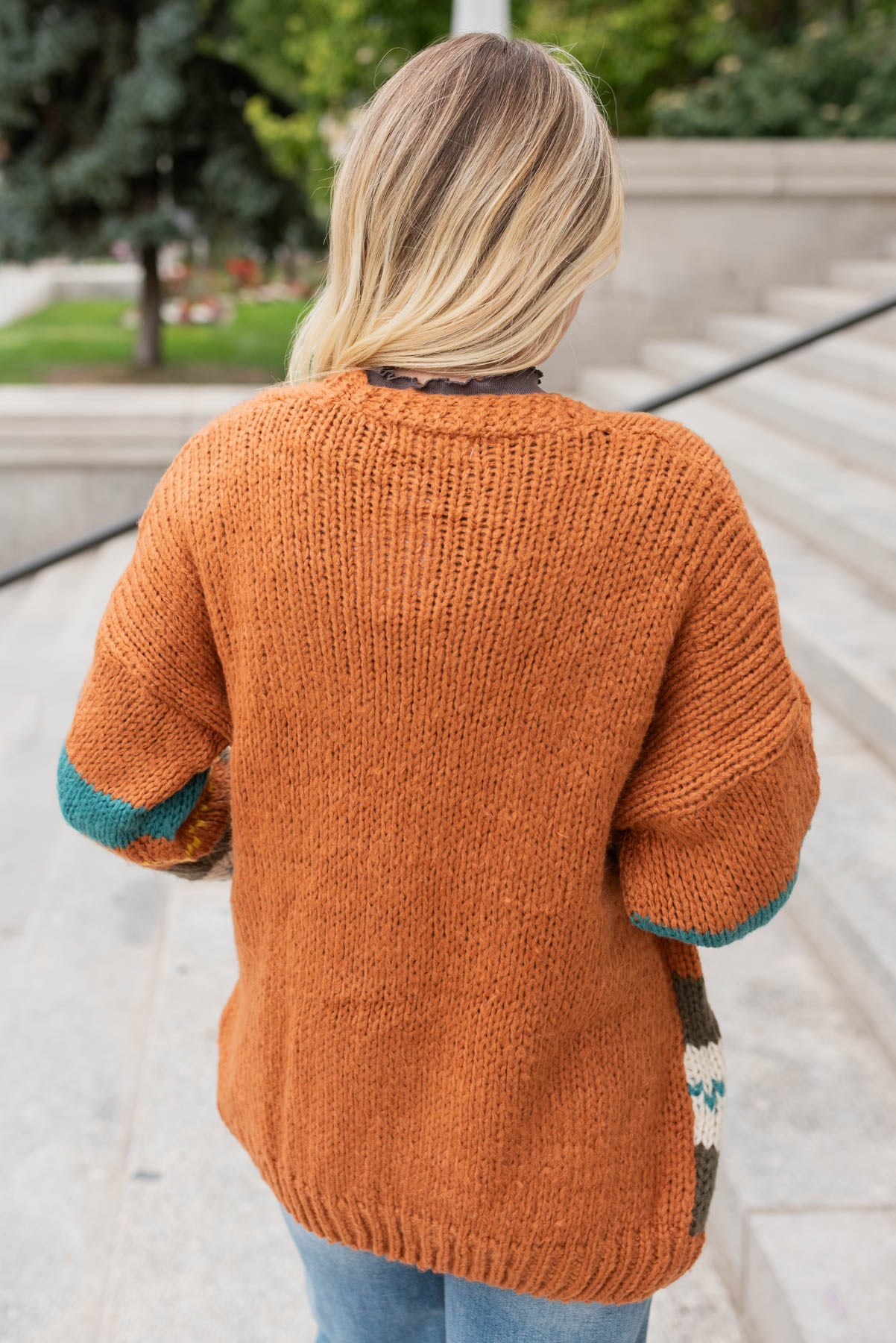 Back view of the color block rust sweater