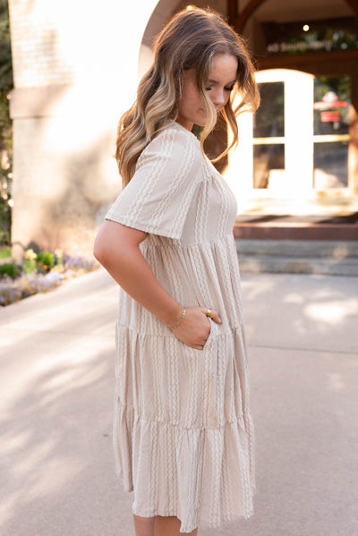 Side view of the tan textured dress