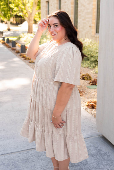 Side view of the tan textured dress