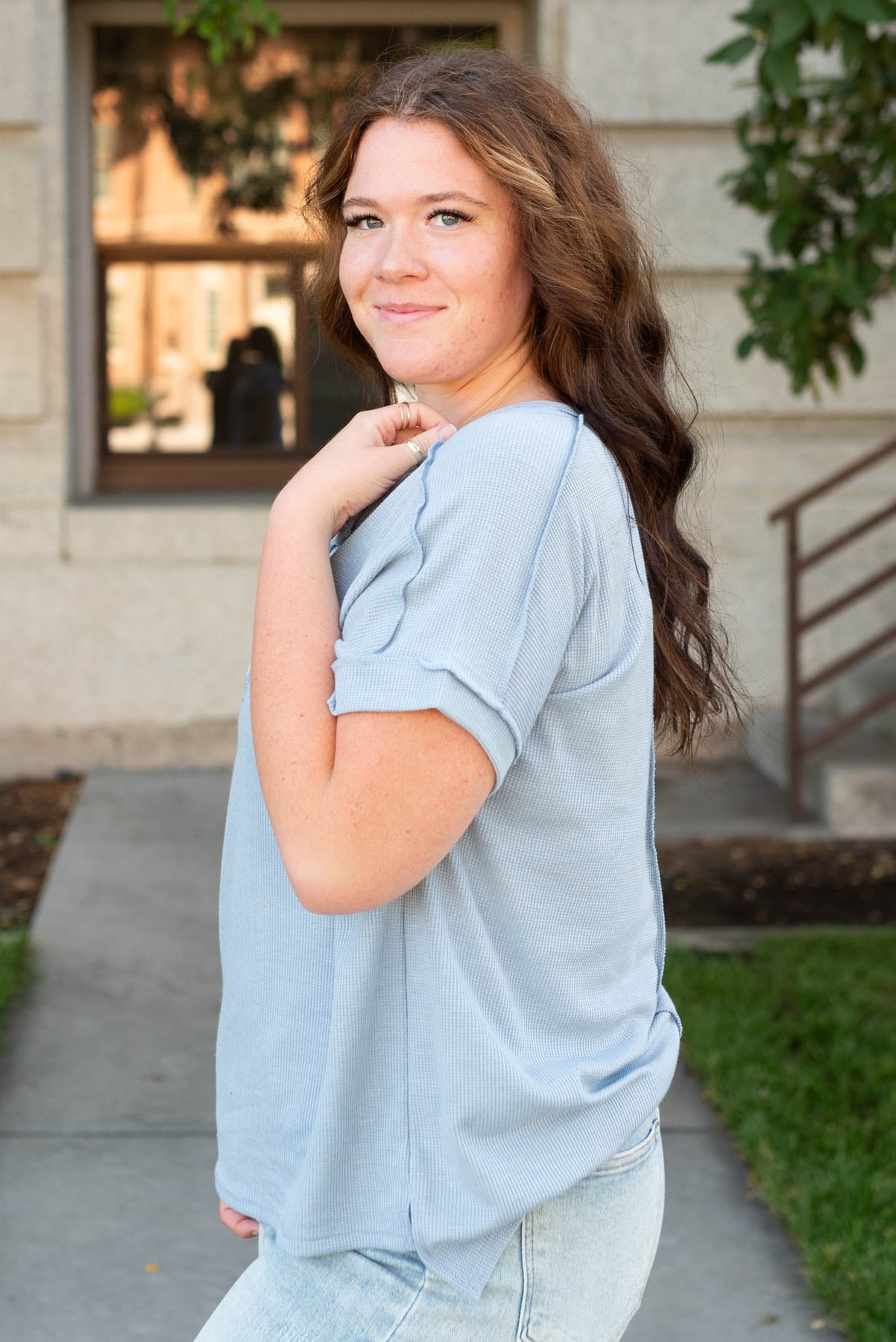 Side view of the plus size vintage blue waffle knit top