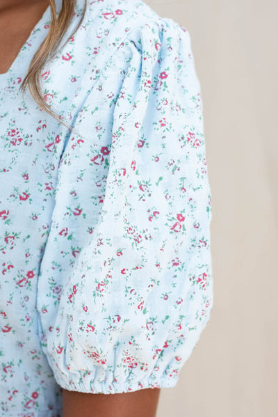 Close up of the sleeve and fabric on the light blue floral dress