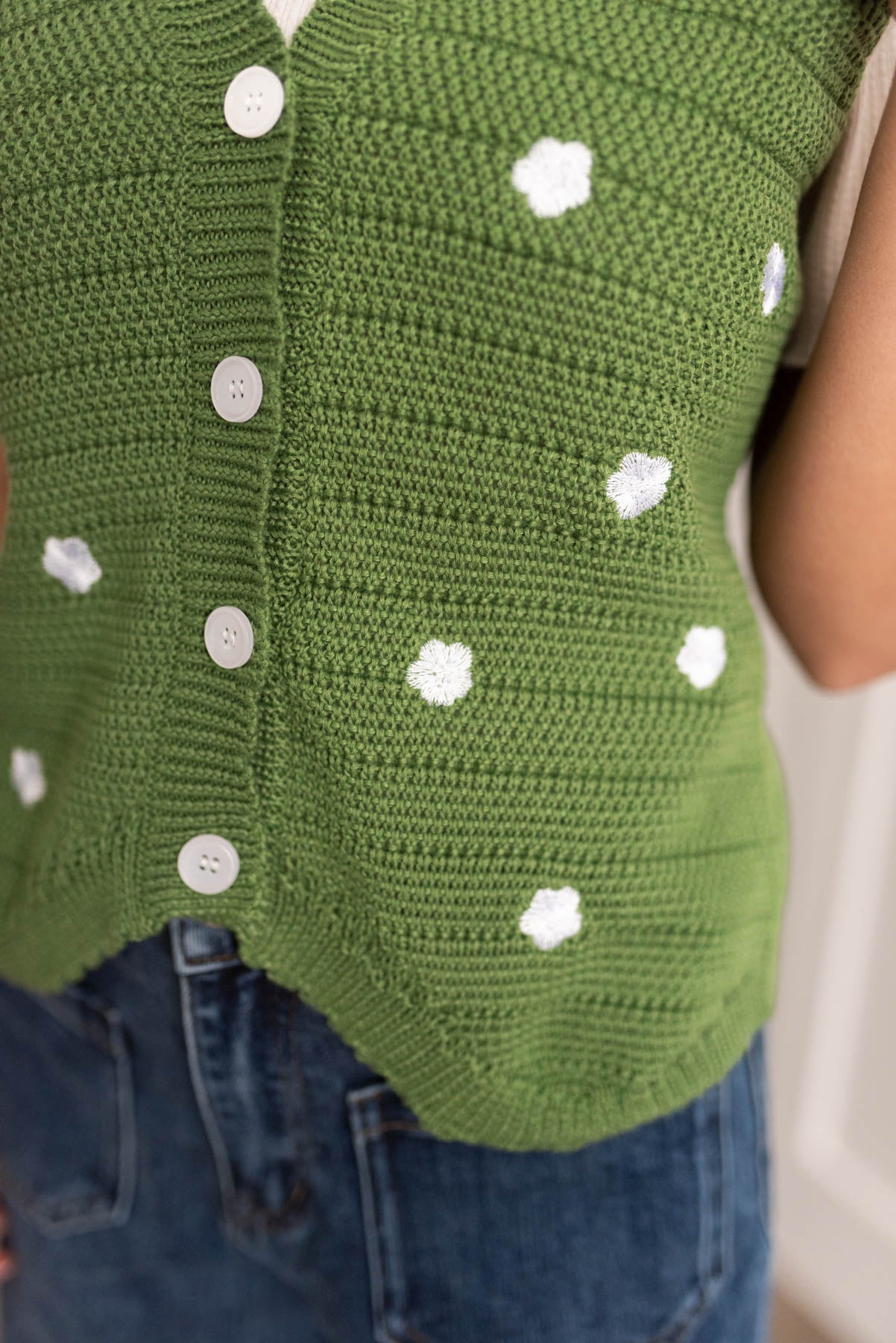 Close up of the green knitted sweater