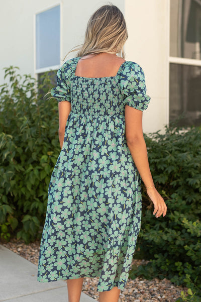 Back view of a short sleeve dark green dress