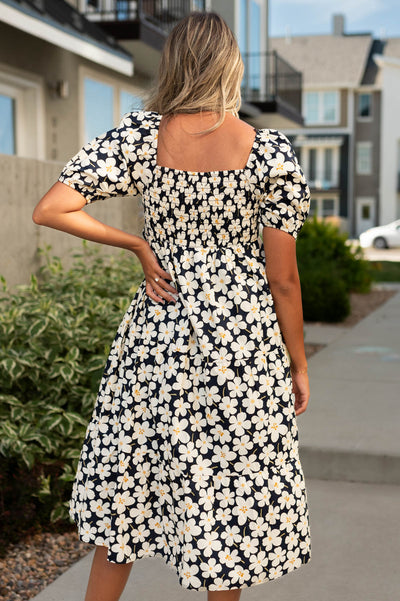 Back view of a ivory dress with floral print