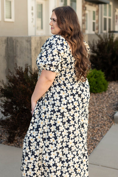 Side view of a plus size ivory dress