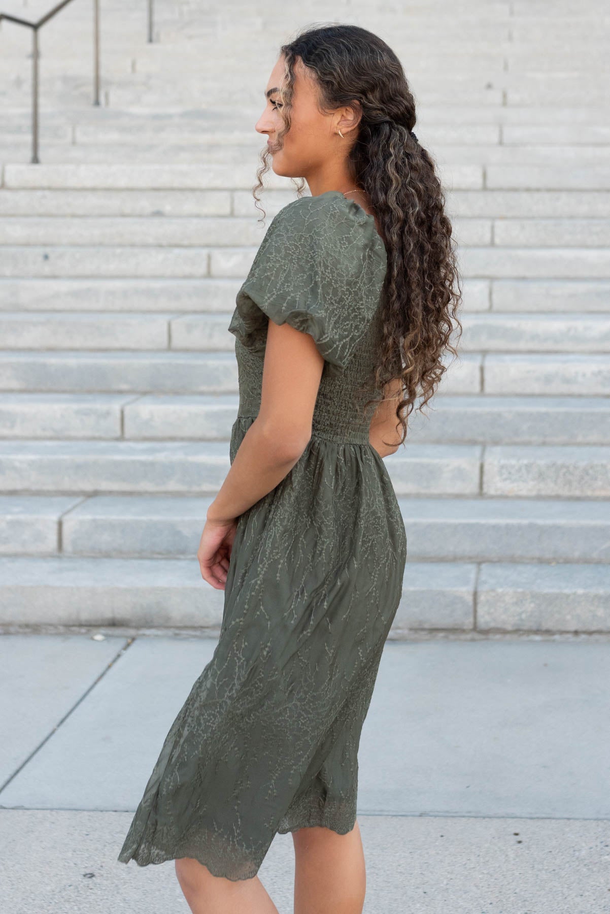 Side view of the olive embroidered square neck dress