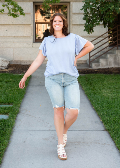 Plus size light blue textured top with short sleeves