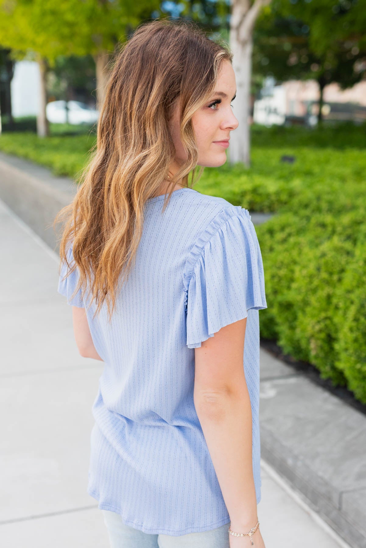 Side view of the light blue textrued top