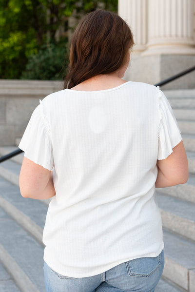 Back view of the plus size off white textured top