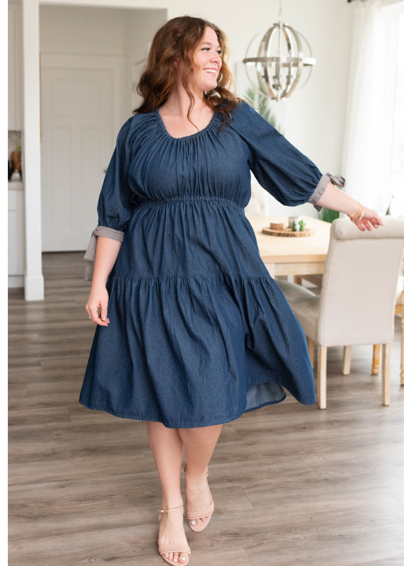 Plus size short sleeve dark denim tiered dress with plaid ties on the cuffs