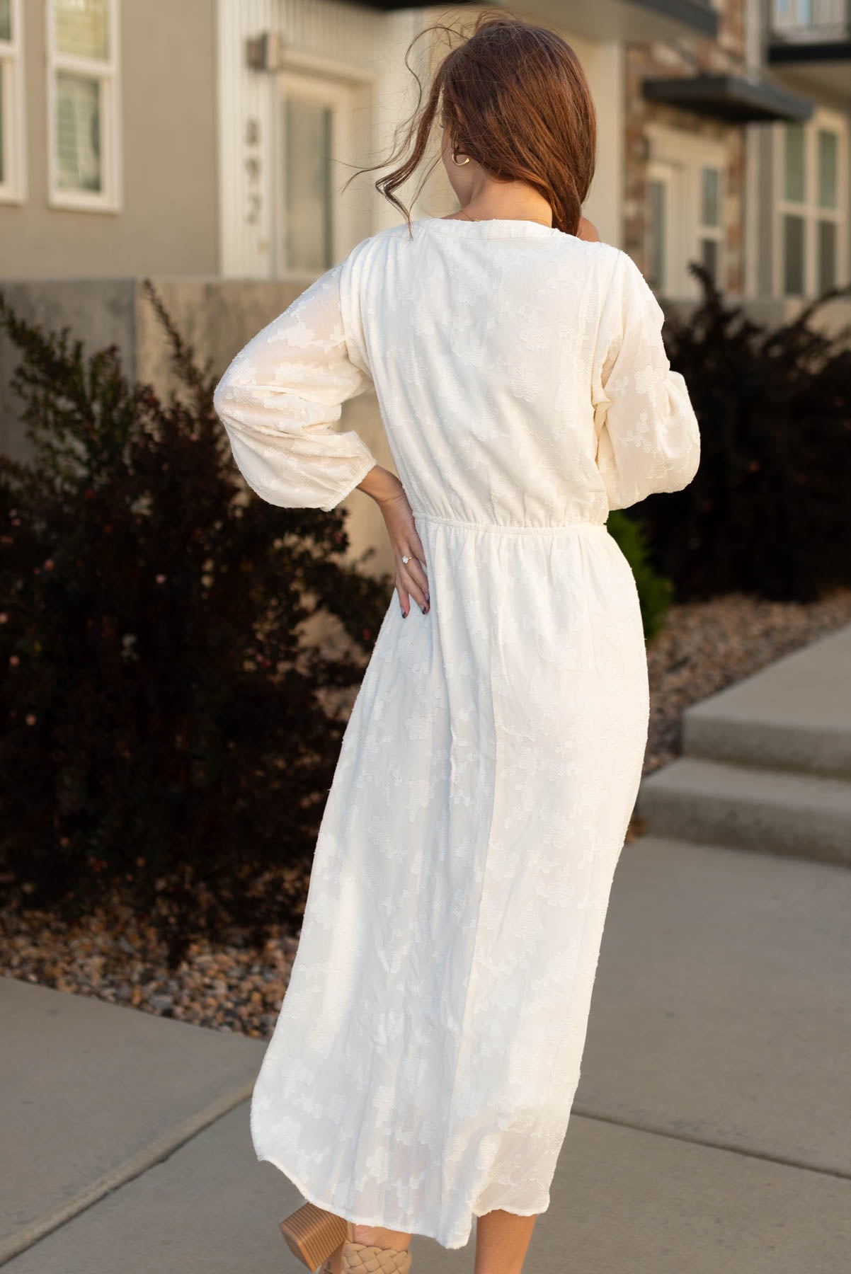 Back view of a cream dress