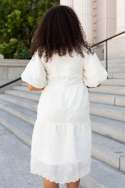 Back view of the cream floral puff sleeve dress