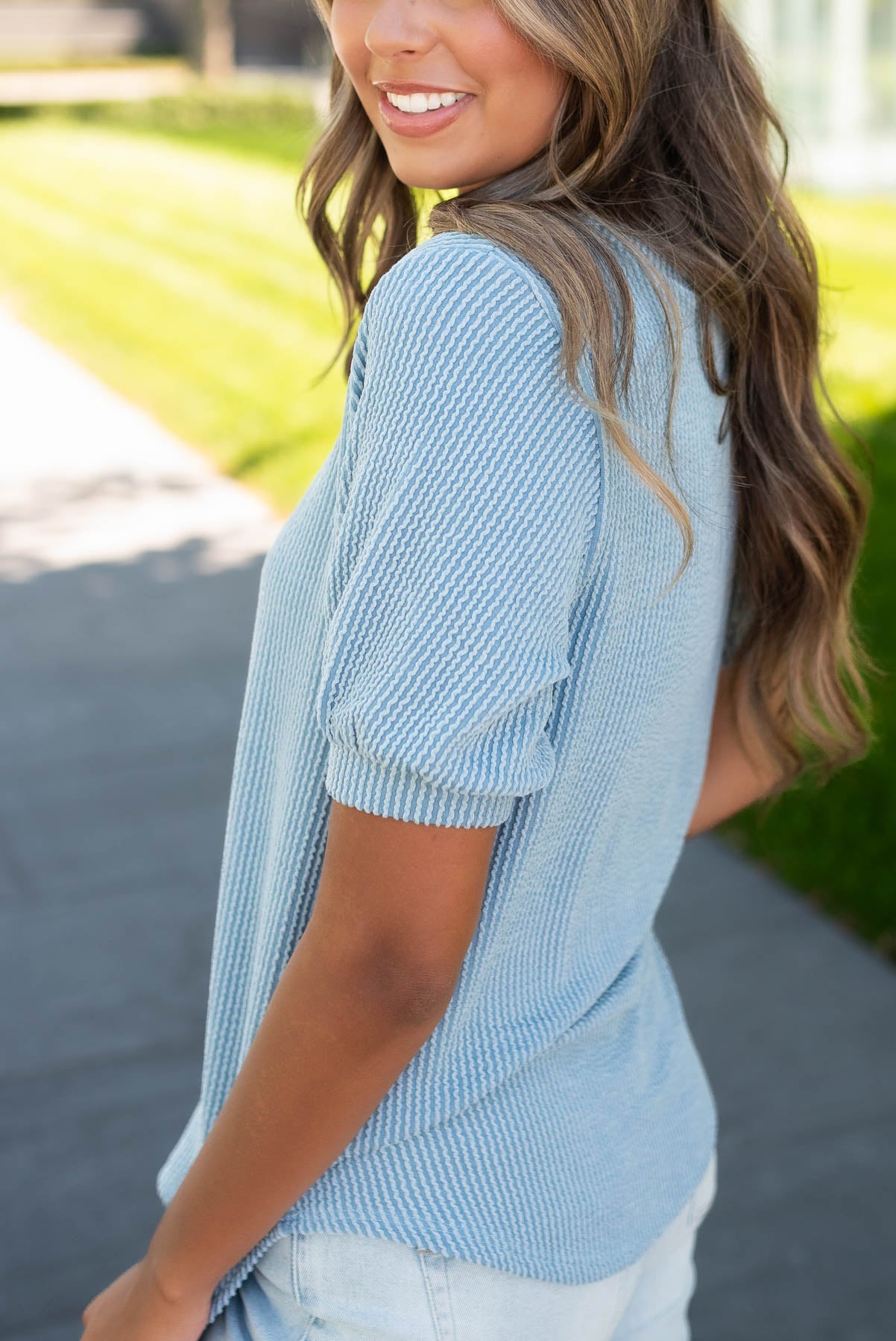 Side view of the denim ribbed top