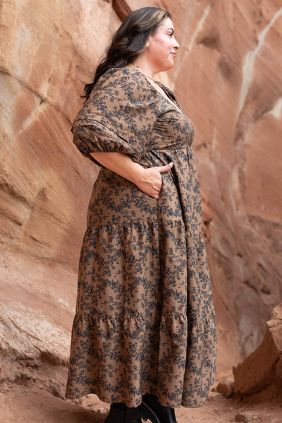 Side view of the brown floral tiered dress with pockets